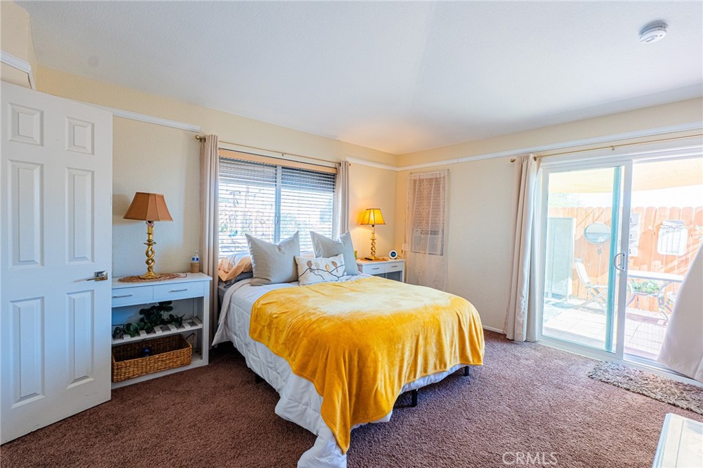 61070 Esparta Avenue Whitewater, CA 92282 - Photo 7 of 10 a bed sitting in a bedroom next to a window