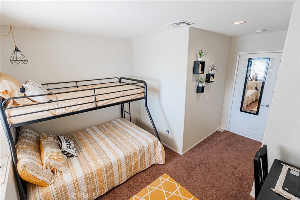 61070 Esparta Avenue Whitewater, CA 92282 - Photo 9 of 10 a bedroom with a bed and closet