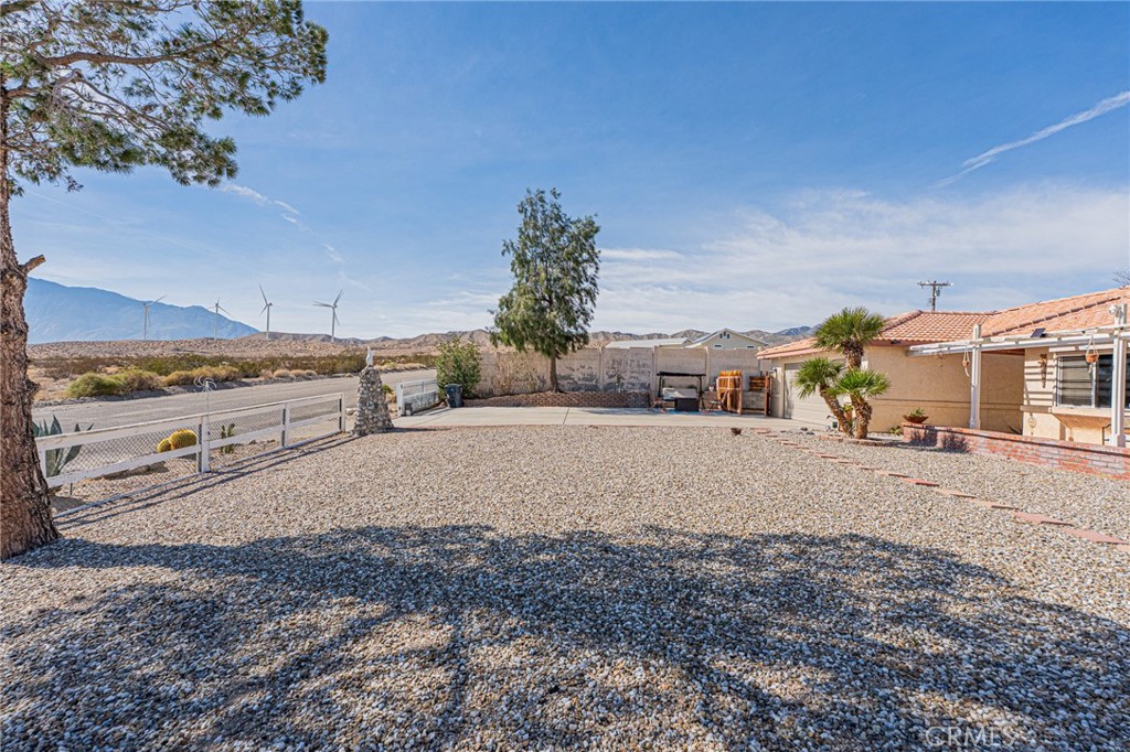 61070 Esparta Avenue Whitewater, CA 92282 - Photo 10 of 10 a view of a dry yard with wooden fence