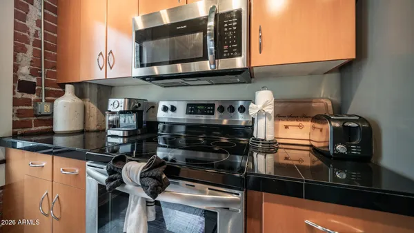 a kitchen with a stove and a microwave