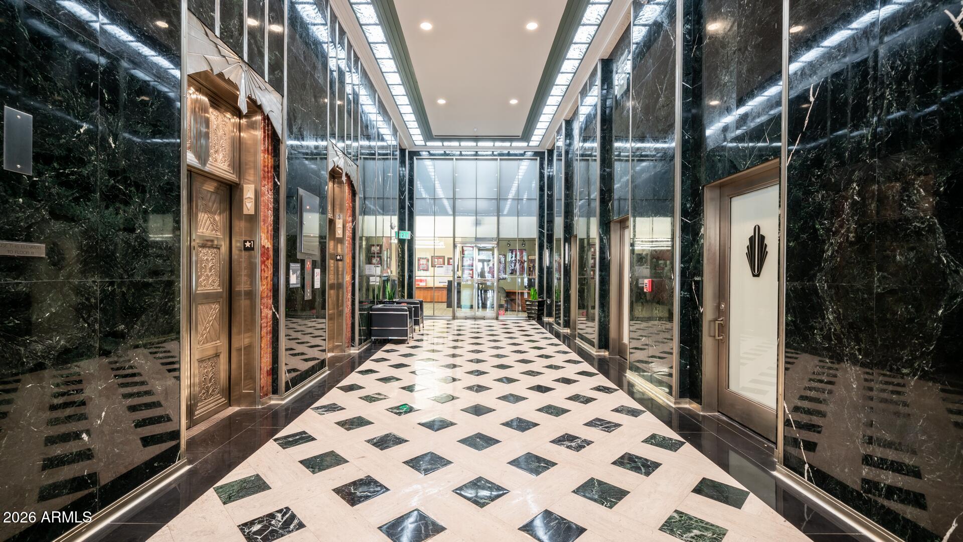 114 West Adams Street, Unit 503 Phoenix, AZ 85003 - Photo 30 of 46 a bathroom with a glass door shower