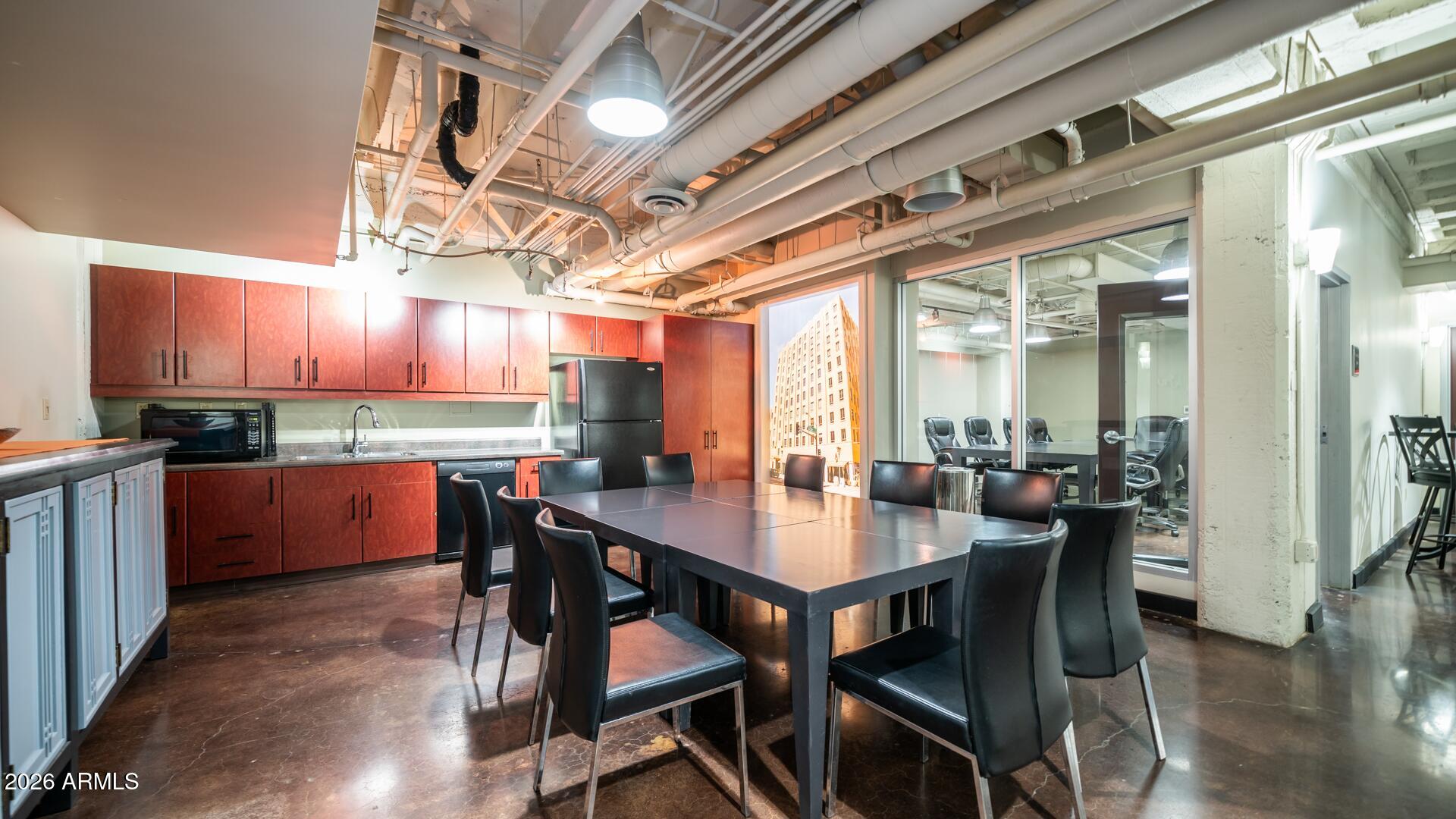114 West Adams Street, Unit 503 Phoenix, AZ 85003 - Photo 35 of 46 a view of a dining room with furniture window and wooden floor