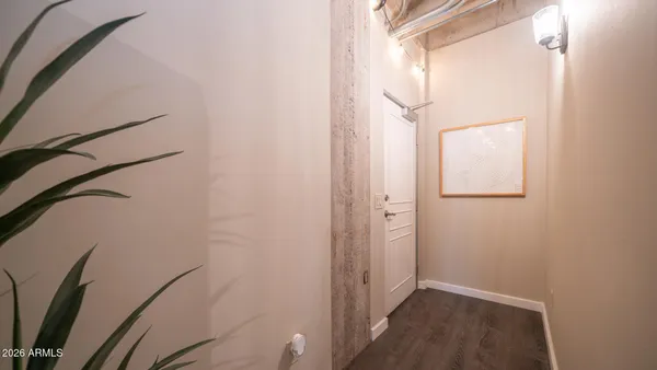 a view of front door with wooden floor
