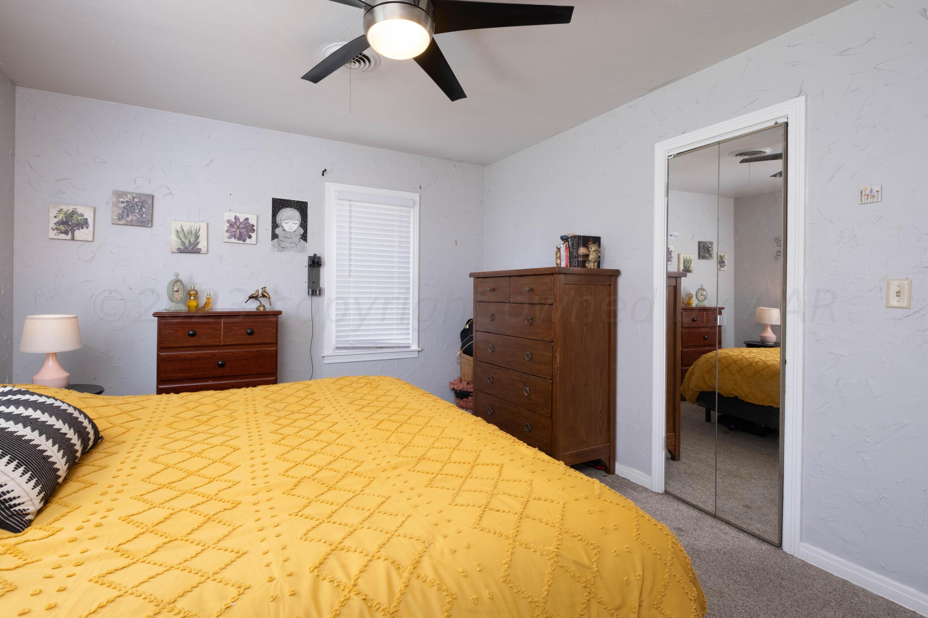 3607 South Lipscomb Street Amarillo, TX 79110 - Photo 16 of 20 a bedroom with a bed and dresser