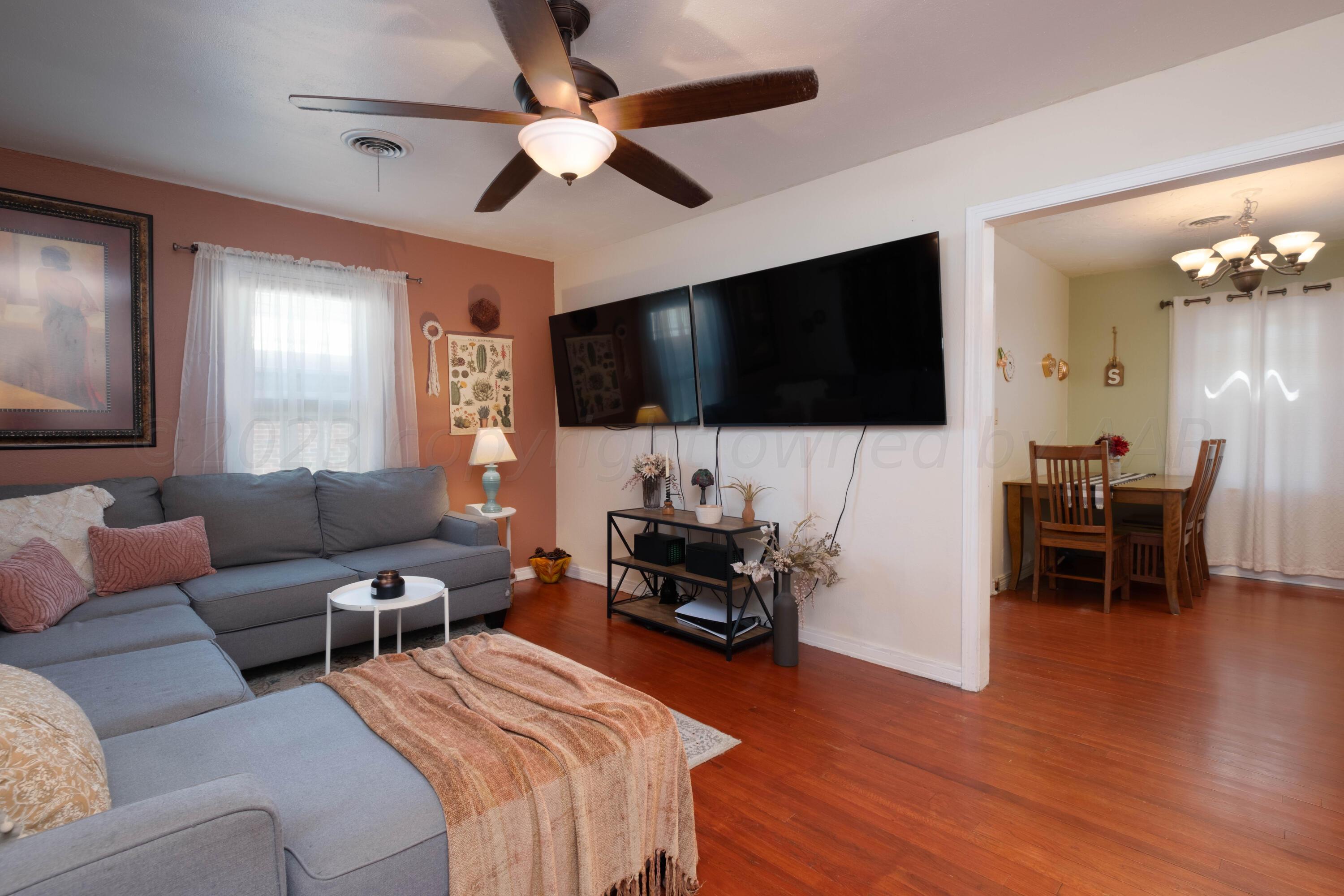 3607 South Lipscomb Street Amarillo, TX 79110 - Photo 3 of 20 a living room with furniture and a flat screen tv