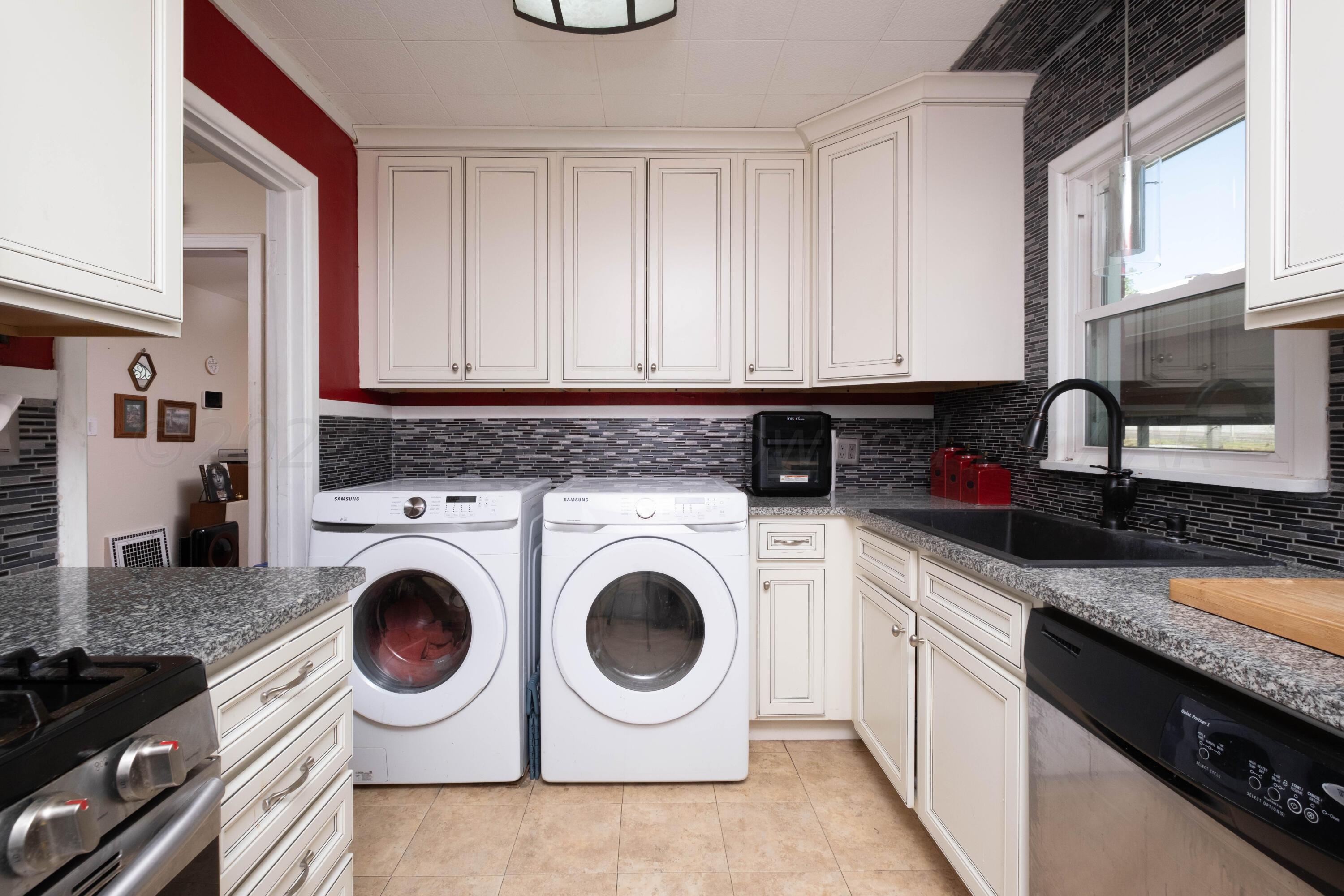 3607 South Lipscomb Street Amarillo, TX 79110 - Photo 10 of 20 a view of a kitchen with washer and dryer