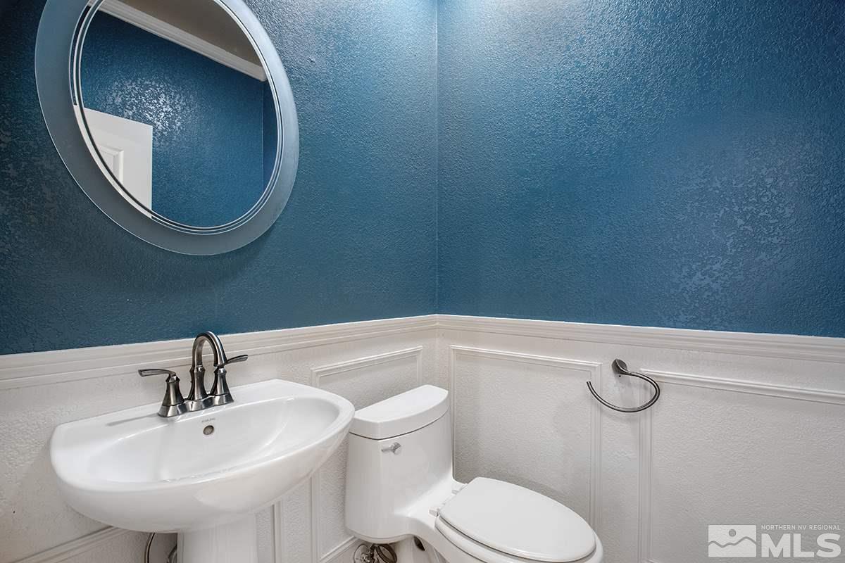 14085 Winners Cup Drive Reno, NV 89521 - Photo 17 of 20 a bathroom with a sink mirror and toilet
