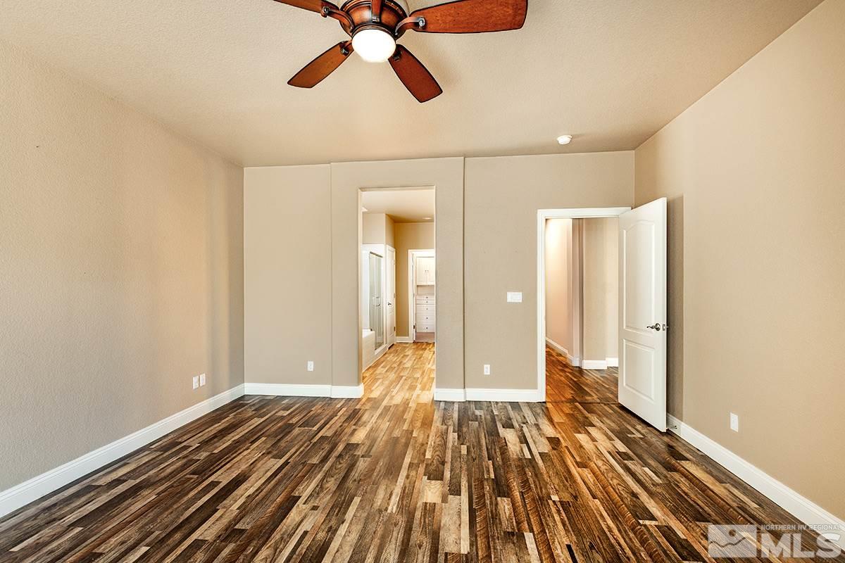14085 Winners Cup Drive Reno, NV 89521 - Photo 10 of 20 a view of an empty room and wooden floor