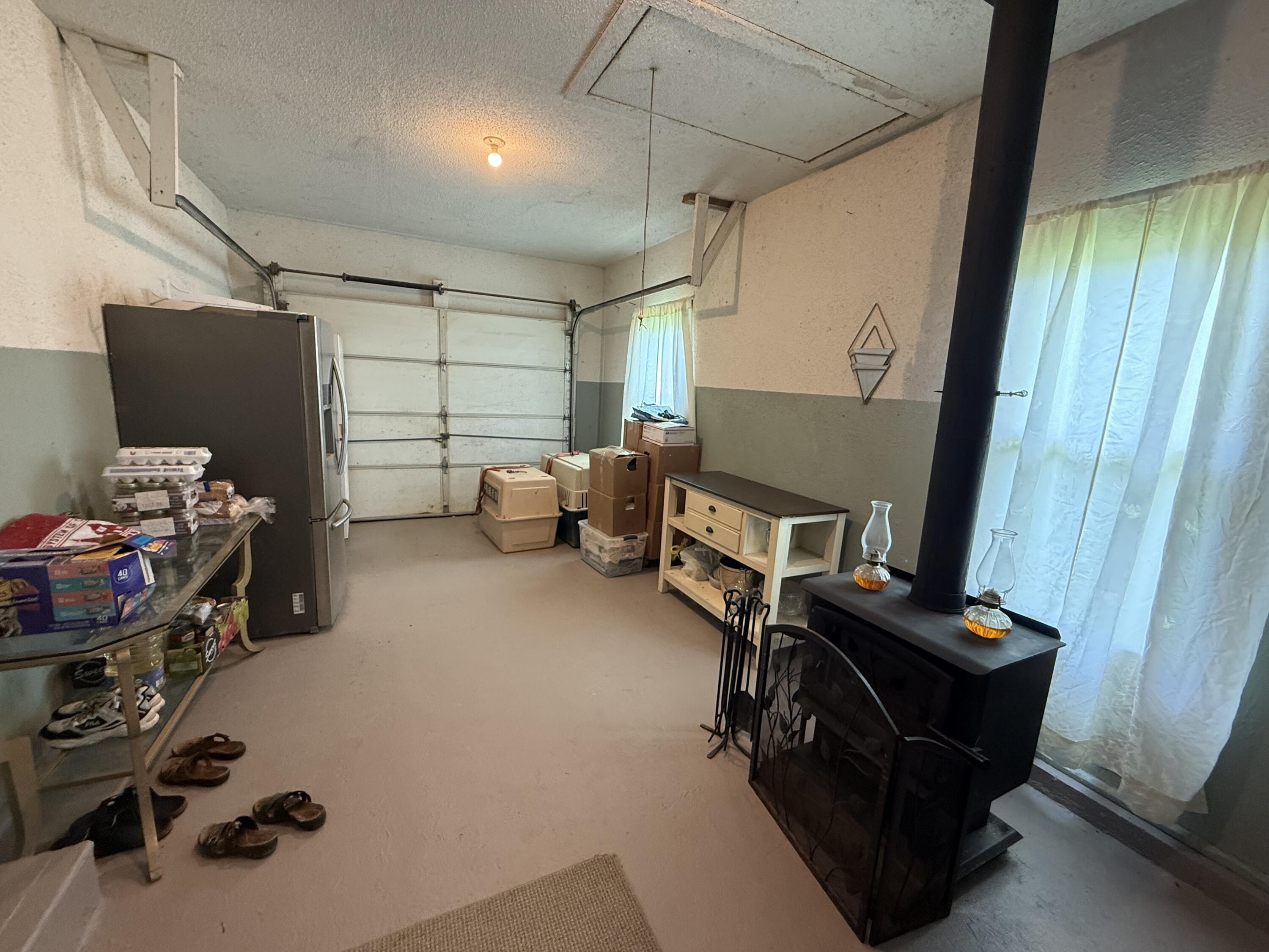 342 Dewey Banks Road Campton, KY 41301 - Photo 49 of 64 049 the garage area with the wood stove