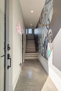 a large kitchen with kitchen island a large counter top space a sink stainless steel appliances and cabinets