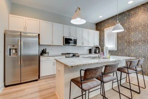 a view of living room with granite countertop furniture and fireplace