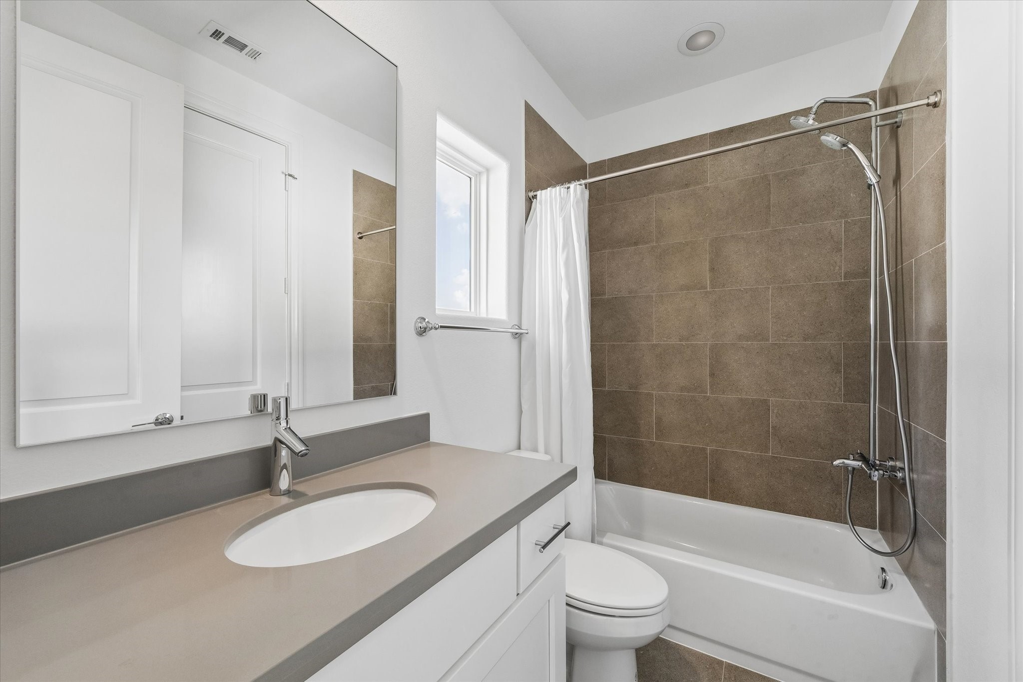 2024 Waterloo Station Road Houston, TX 77045 - Photo 16 of 19 En Suite bathroom features a tub.