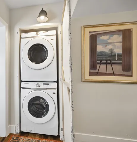 a view of a hallway with washer and dryer