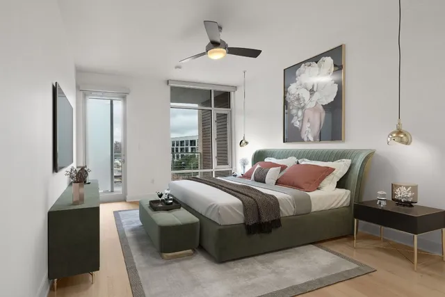 a bedroom with a bed and a chandelier