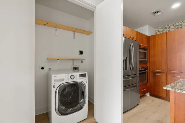 a view of a storage & utility room with washer and dryer