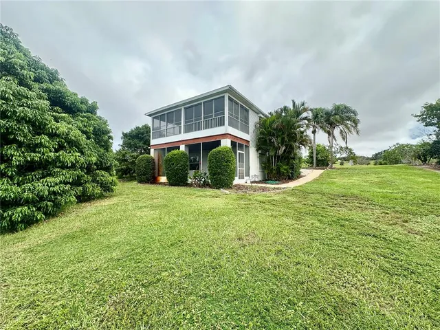 a view of a garden with a lake