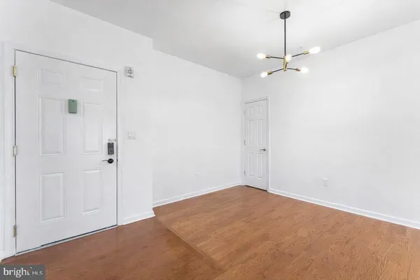 a view of a livingroom with furniture and wooden floor
