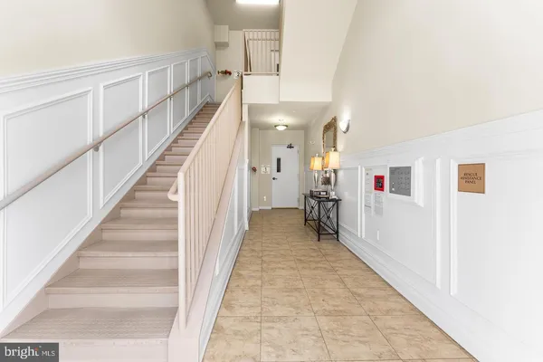 a view of a hallway with staircase