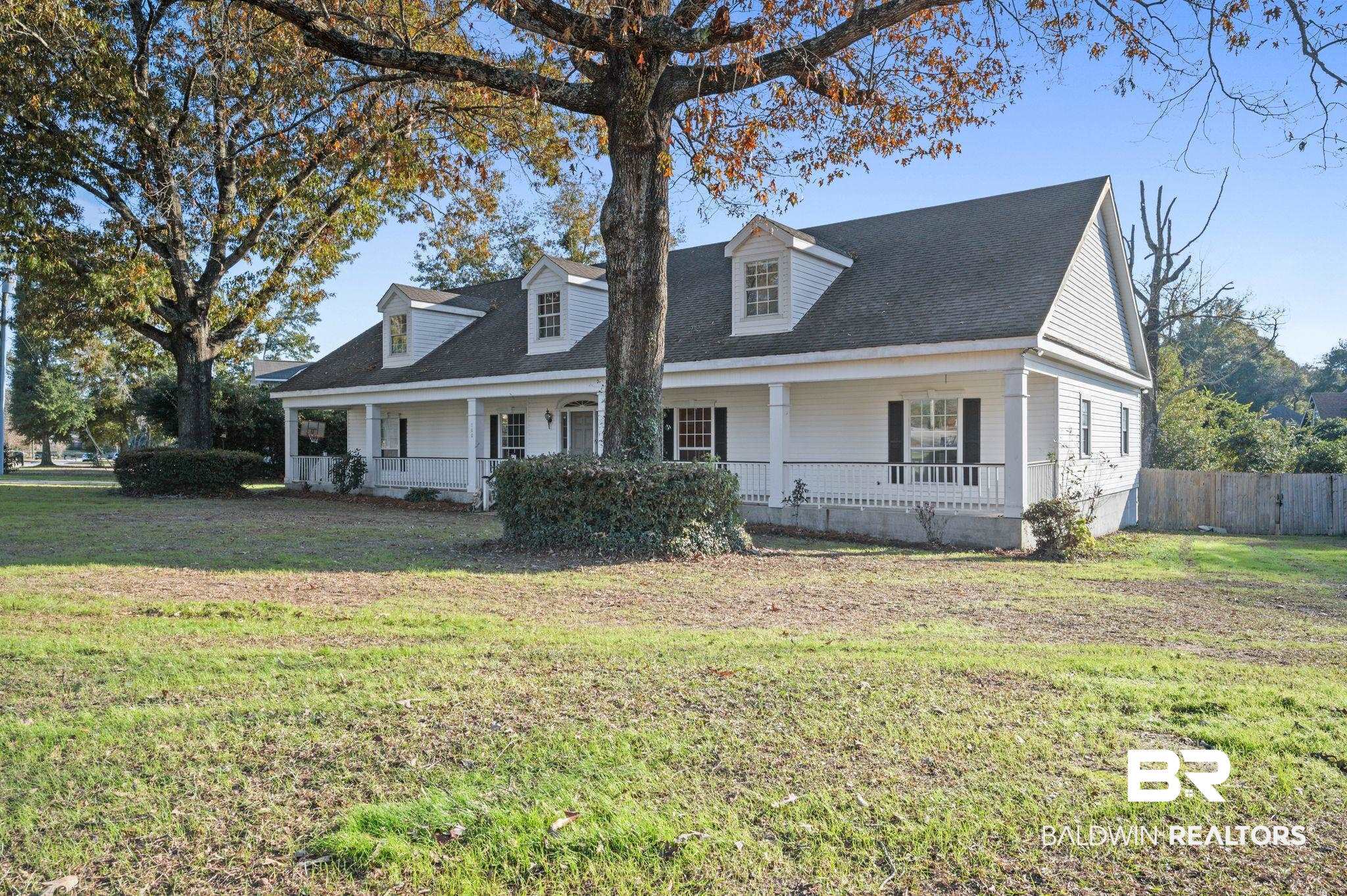 100 Orleans Way Daphne, AL 36526 - Photo 1 of 31 Cape cod home featuring covered porch and a front lawn