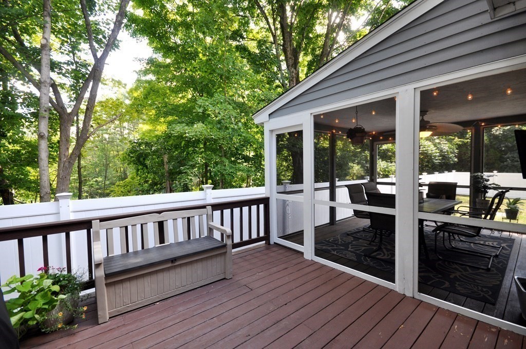131 Sugar Road Bolton, MA 01740 - Photo 26 of 37 a view of a chair and tables in the balcony