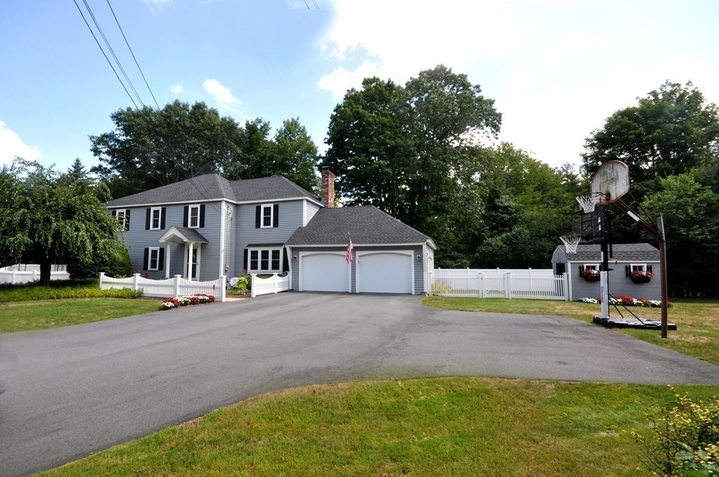 131 Sugar Road Bolton, MA 01740 - Photo 34 of 37 a view of a house with a big yard and large trees