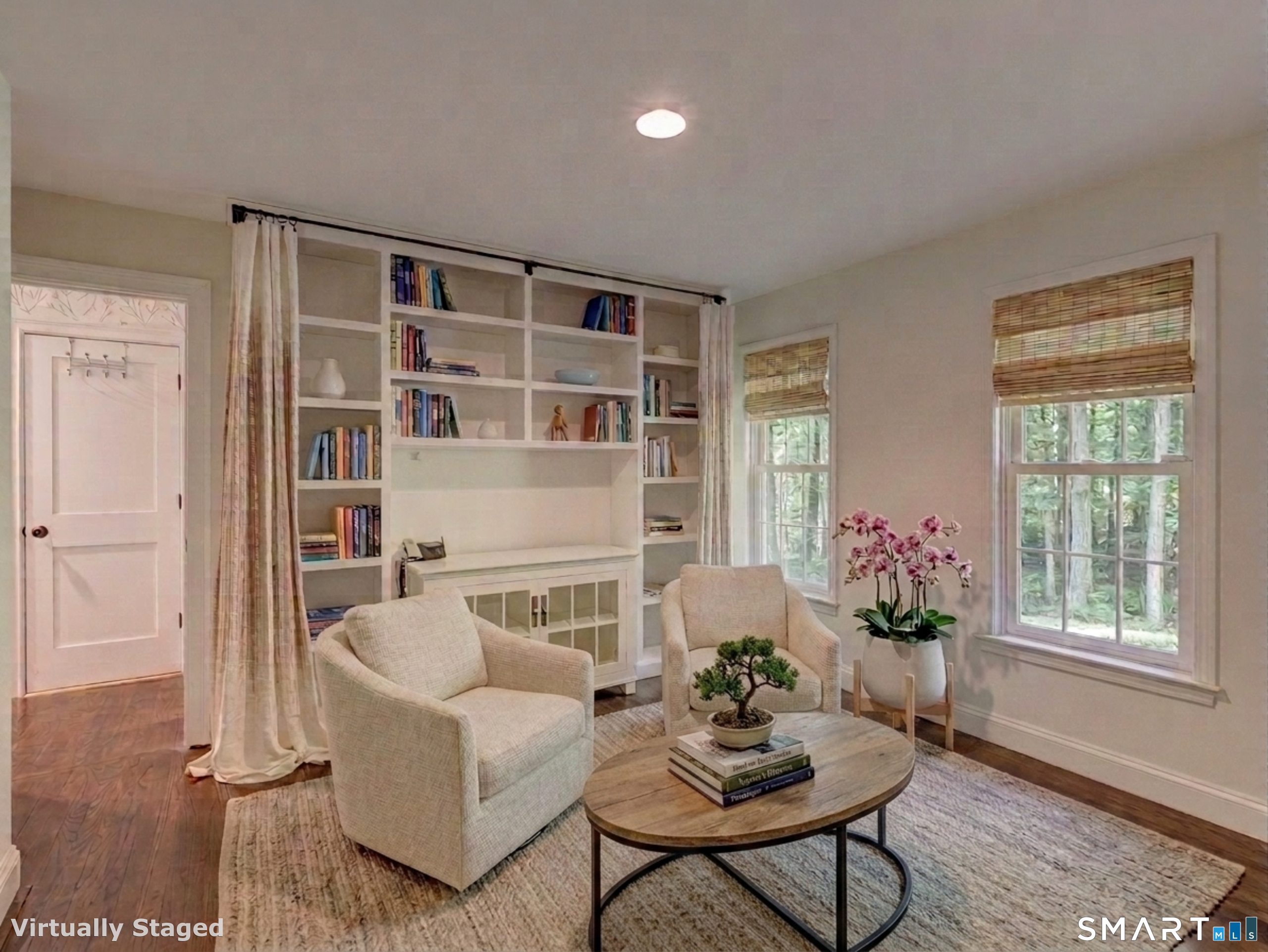 198 Summer Hill Road Madison, CT 06443 - Photo 10 of 22 This is the first floor den. I added books in the book shelves and a few chairs and table on the virtual staging, but it is a perfect in home office or homework room.