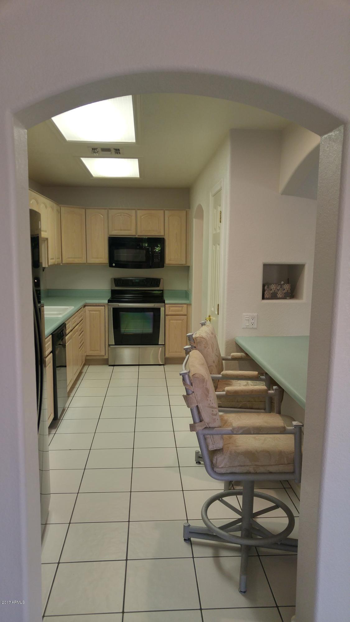 2329 North Recker Road, Unit 91 Mesa, AZ 85215 - Photo 9 of 71 Kitchen with above cabinet shelves