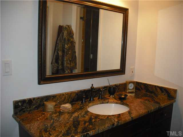 3316 Manor Ridge Drive Raleigh, NC 27603 - Photo 10 of 15 Master bath has been beautifully remodeled with new fixtures, granite (on both vanities) and includes as large steam/sauna/shower! Master Bath/Spa