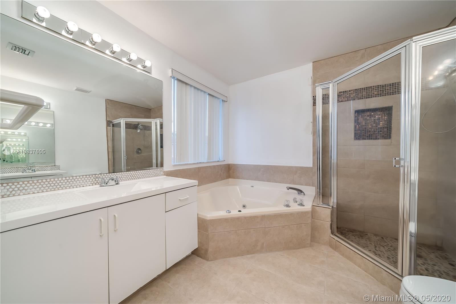11325 Roundelay Road Cooper City, FL 33026 - Photo 22 of 46 Stall shower has new tile as well as Jacuzzi tub in Master Bath