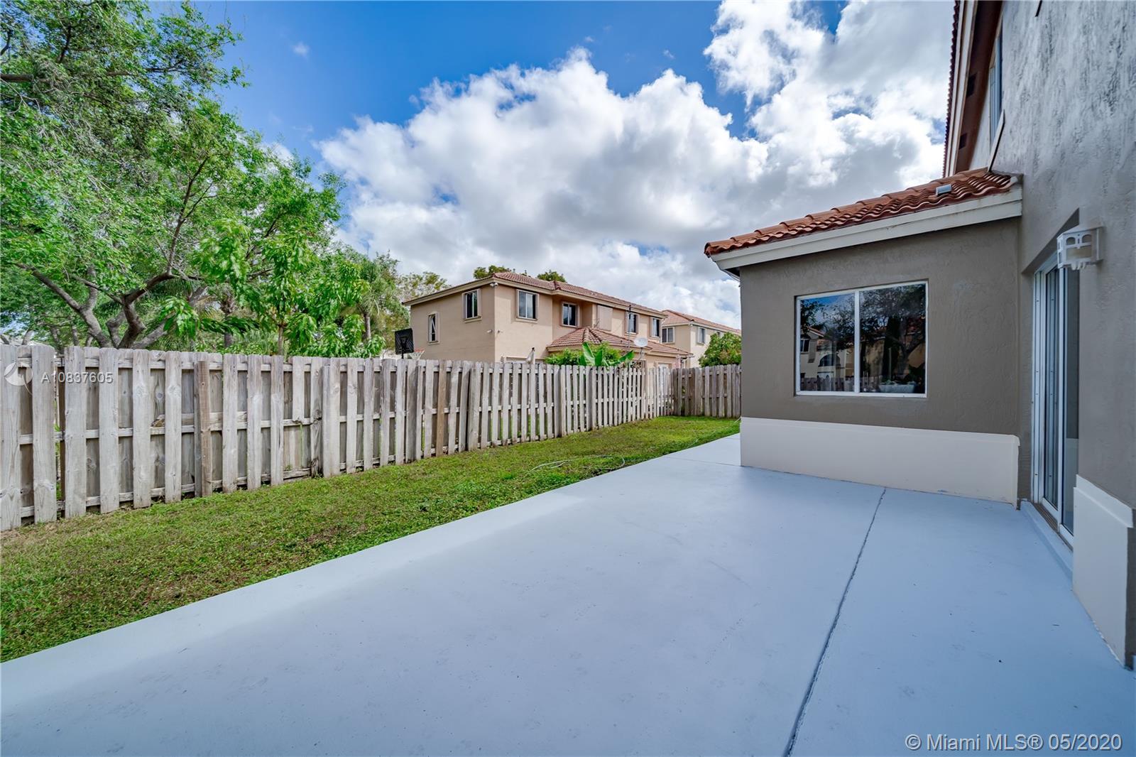 11325 Roundelay Road Cooper City, FL 33026 - Photo 29 of 46 Large outside patio in fully fenced yard