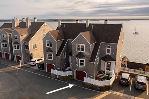12 Spinnaker Hill Lane, Unit 12 Hull, MA 02045 - Photo 11 of 39 an aerial view of a house with parking space