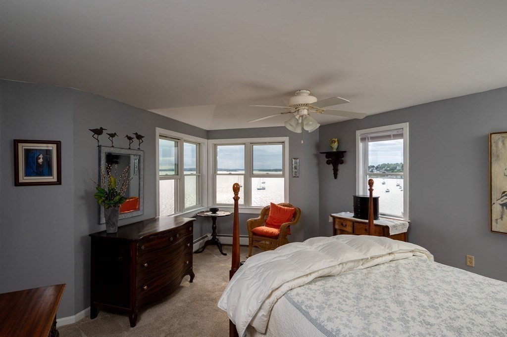 12 Spinnaker Hill Lane, Unit 12 Hull, MA 02045 - Photo 15 of 39 a bed room with a bed window and dresser