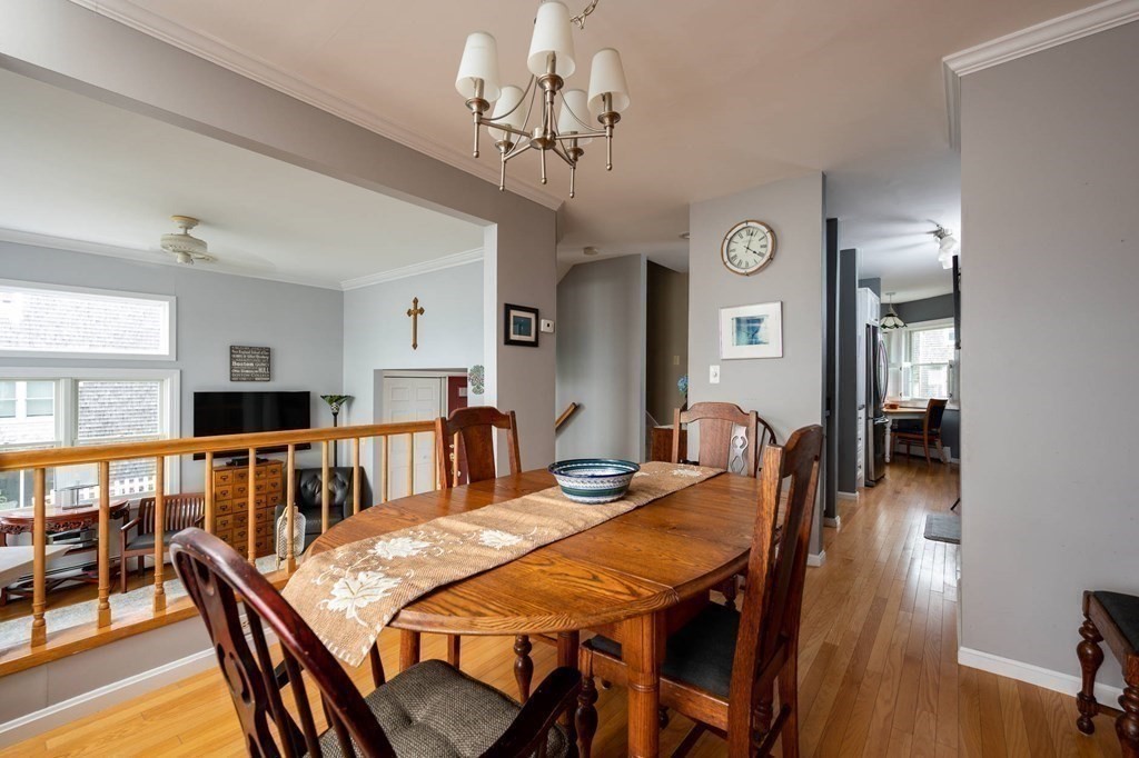 12 Spinnaker Hill Lane, Unit 12 Hull, MA 02045 - Photo 18 of 39 a view of a dining room with furniture and wooden floor