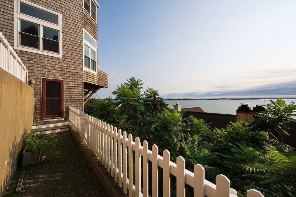 12 Spinnaker Hill Lane, Unit 12 Hull, MA 02045 - Photo 21 of 39 a view of a house with wooden fence
