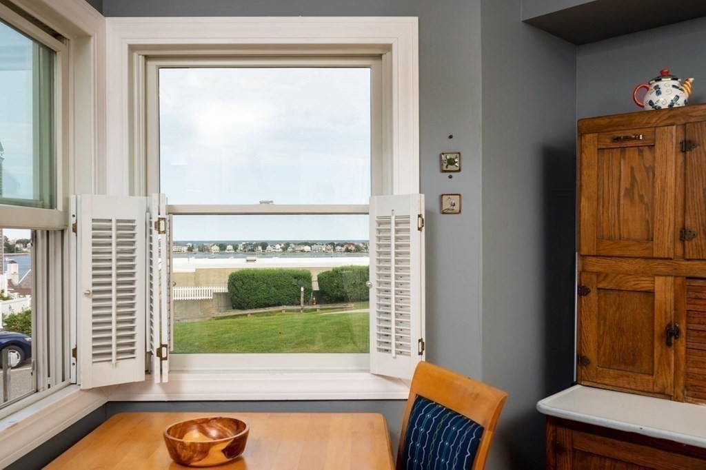 12 Spinnaker Hill Lane, Unit 12 Hull, MA 02045 - Photo 22 of 39 a view of a door and chair in the balcony
