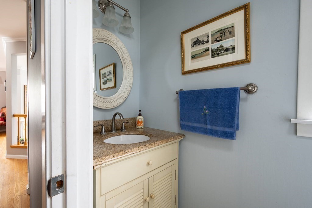 12 Spinnaker Hill Lane, Unit 12 Hull, MA 02045 - Photo 26 of 39 a bathroom with a sink and a mirror