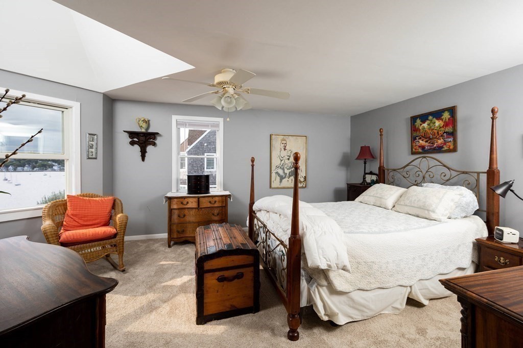 12 Spinnaker Hill Lane, Unit 12 Hull, MA 02045 - Photo 30 of 39 a bed room with a bed and furniture
