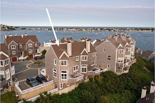 12 Spinnaker Hill Lane, Unit 12 Hull, MA 02045 - Photo 5 of 39 an aerial view of a house with parking space and a building