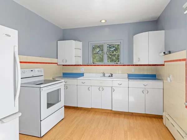 a view of a kitchen with cabinets