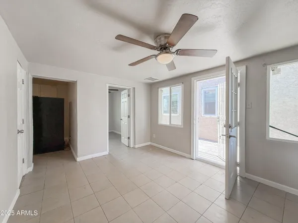 a view of an empty room with a window
