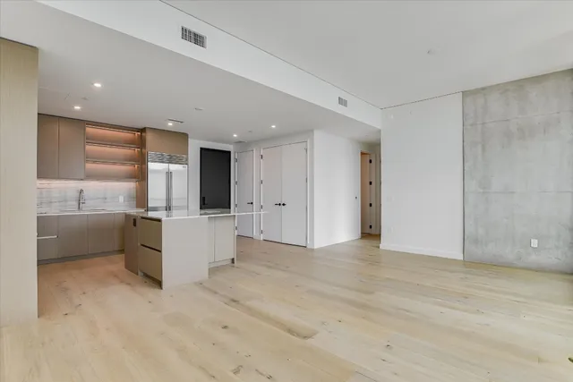 a view of a kitchen with a sink and cabinets