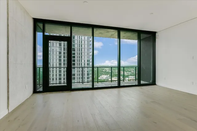 a view of an empty room with a large window