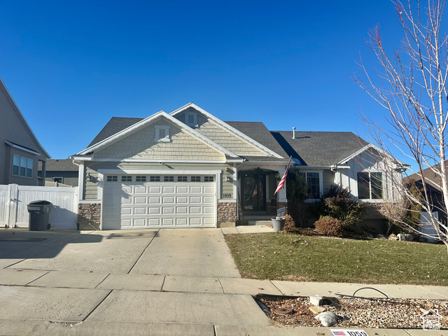 1059 Quail Run Lane Elk Ridge, UT 84651 - Photo 1 of 1 View of front facade with a front yard and a garage