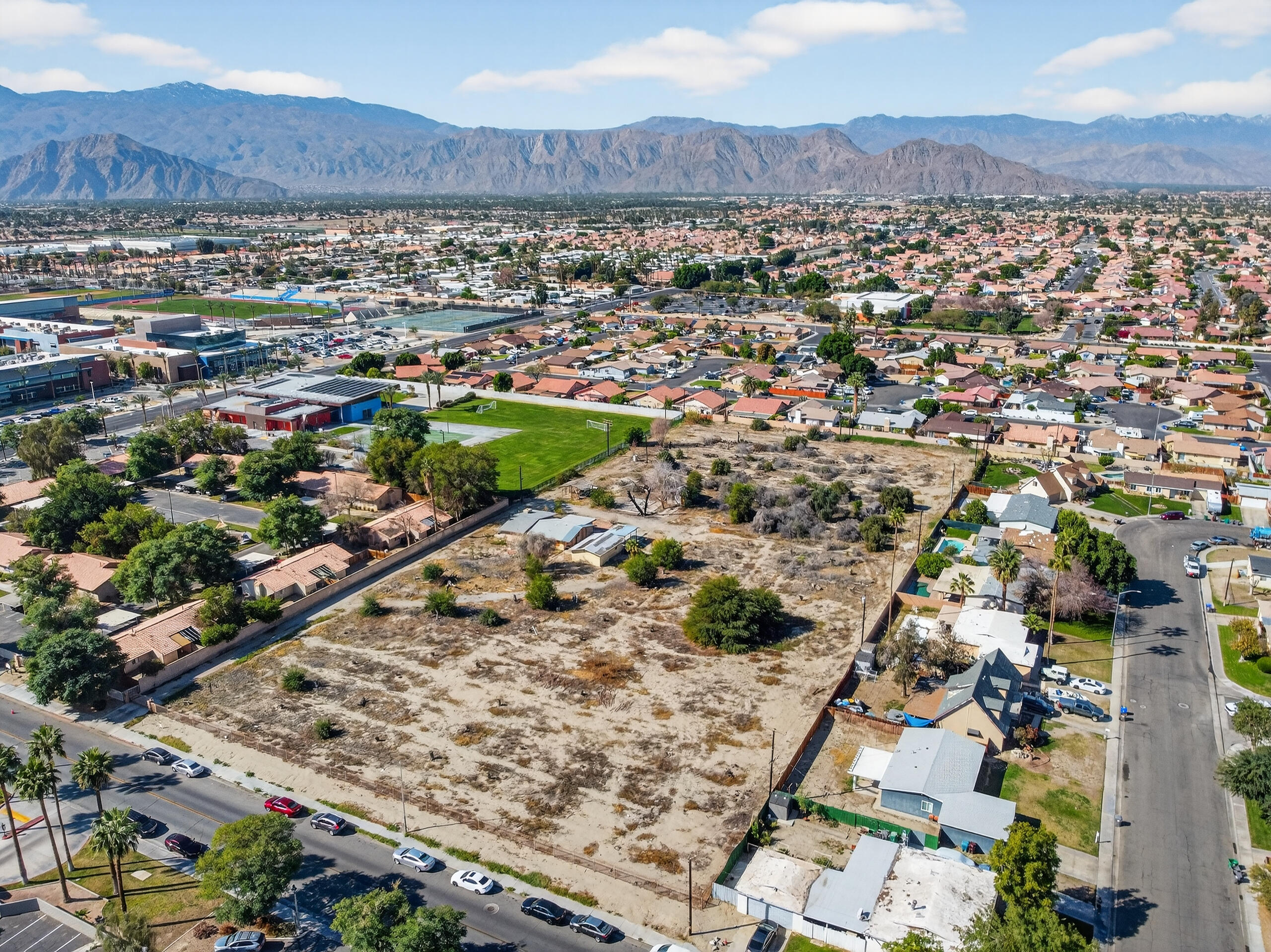 45751 Aladdin Street Indio, CA 92201 - Photo 3 of 10 an aerial view of residential houses with outdoor space