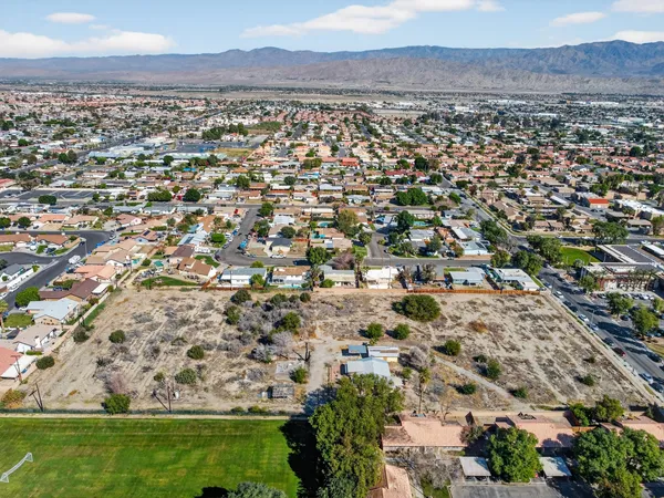 an aerial view of residential building and outdoor space