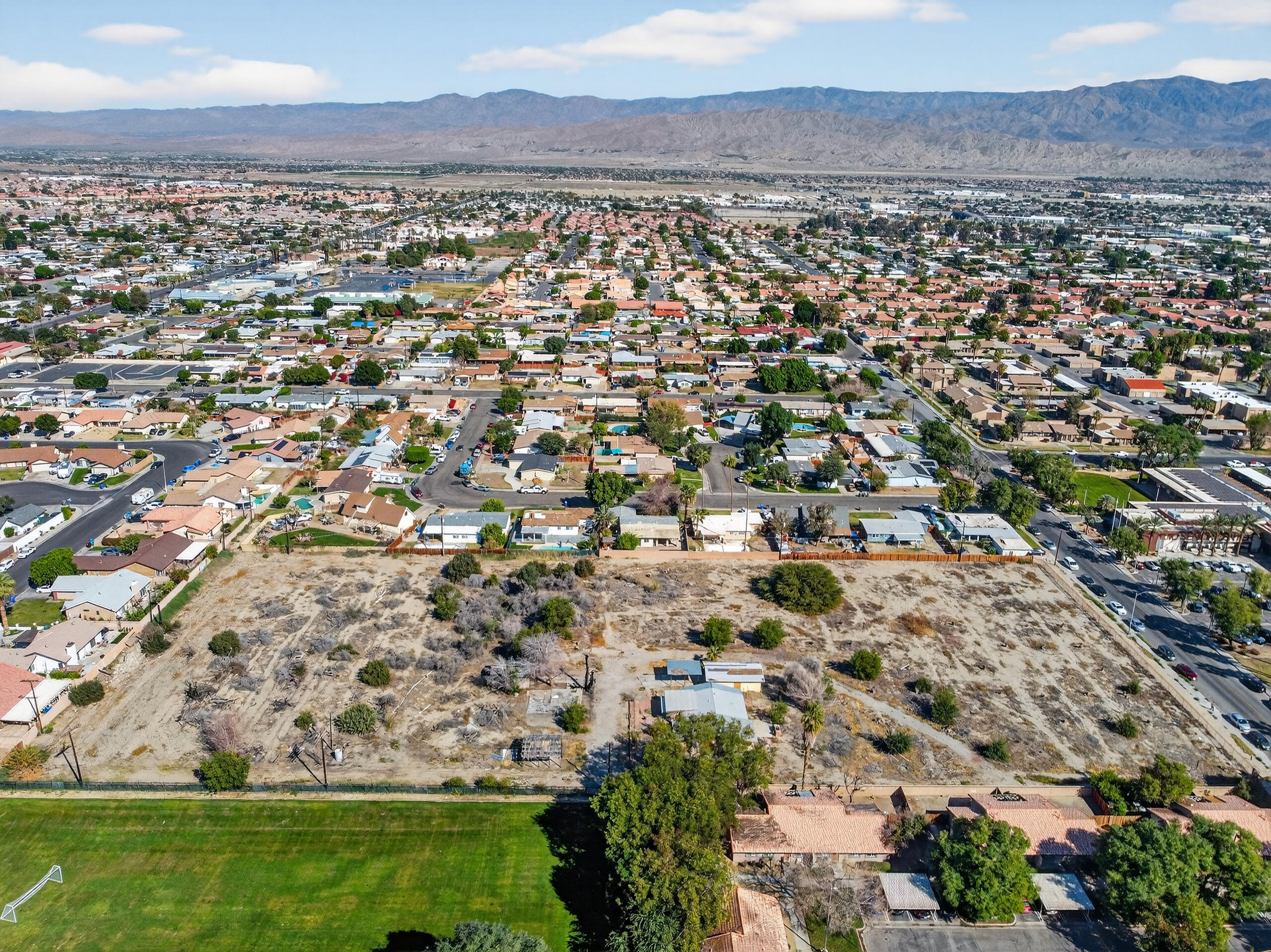 45751 Aladdin Street Indio, CA 92201 - Photo 5 of 10 an aerial view of residential building and outdoor space
