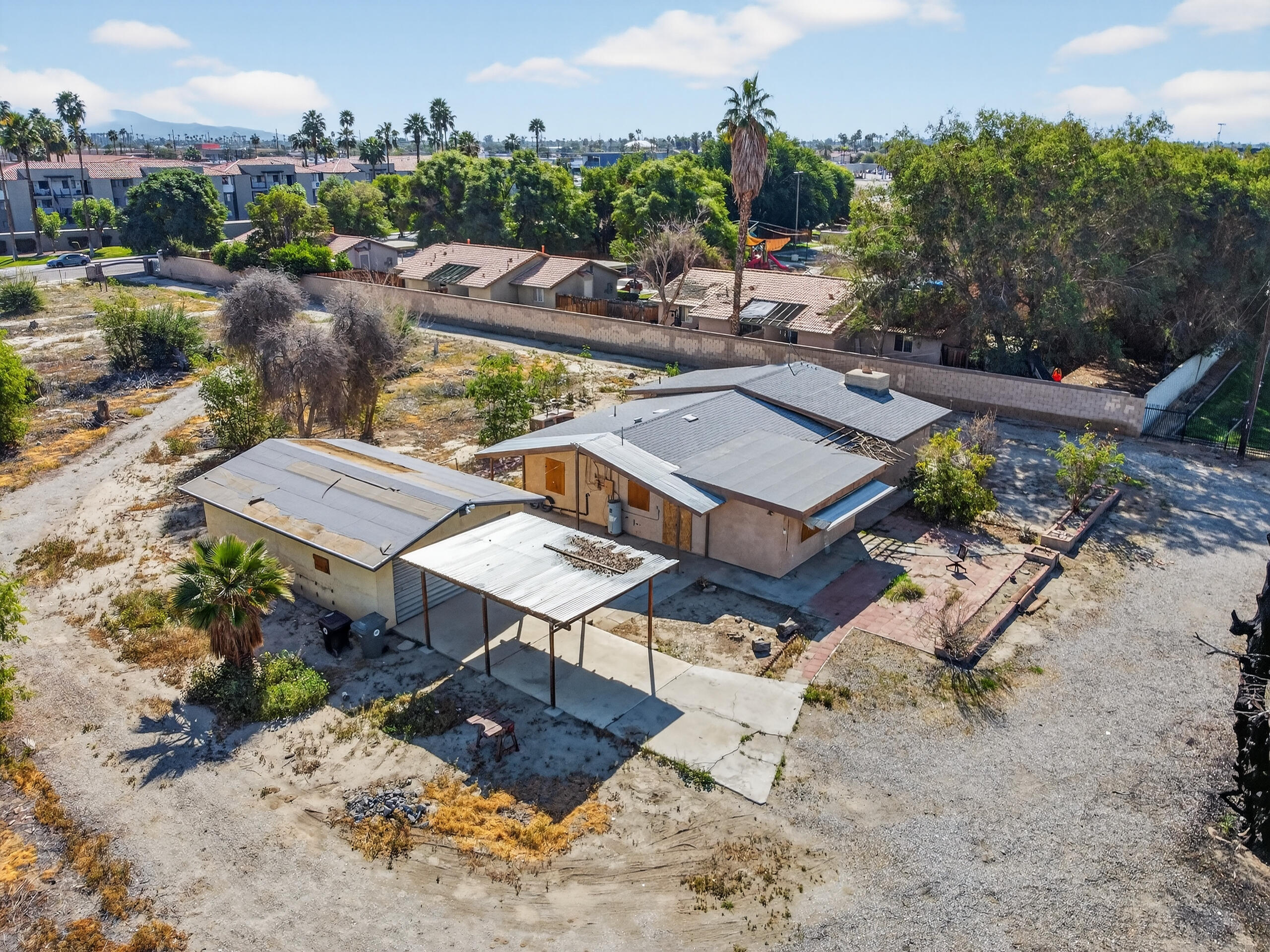 45751 Aladdin Street Indio, CA 92201 - Photo 6 of 10 an aerial view of a swimming pool patio and mountain view