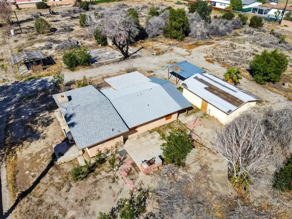 an aerial view of residential house with outdoor space