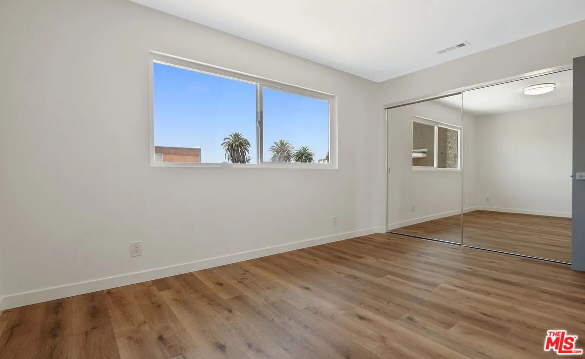 110 South Eucalyptus Avenue, Unit 5 Inglewood, CA 90301 - Photo 7 of 12 a view of a room with wooden floor and window