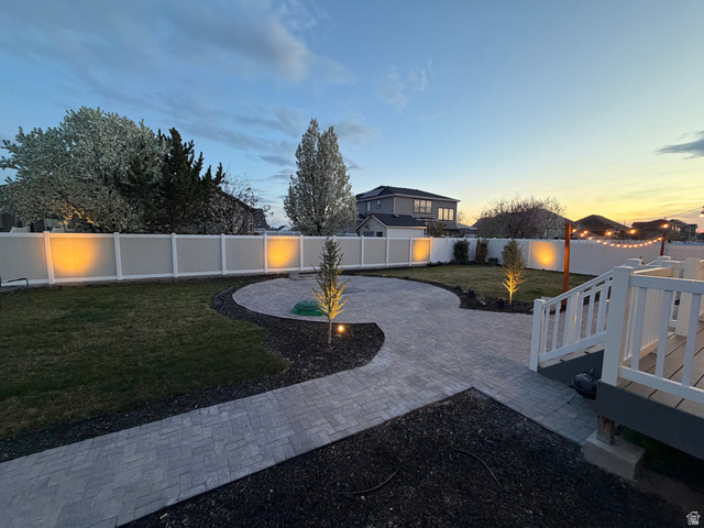 3359 Eurasian Crane Road Clinton, UT 84015 - Photo 67 of 71 Fenced backyard featuring a patio and decorative driveway